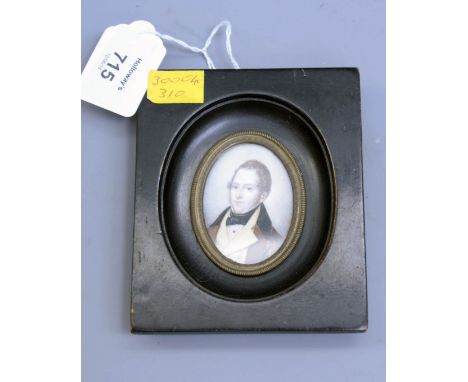 An early 19th century oval portrait miniature on ivory, of a gentleman in formal attire, 6 x 4.5cm oval