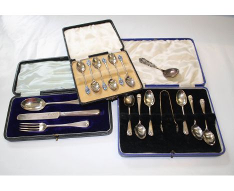 A cased set of six silver and enamel coffee spoons, two tone blue enamel terminals, Birmingham 1935, a cased set of six silve