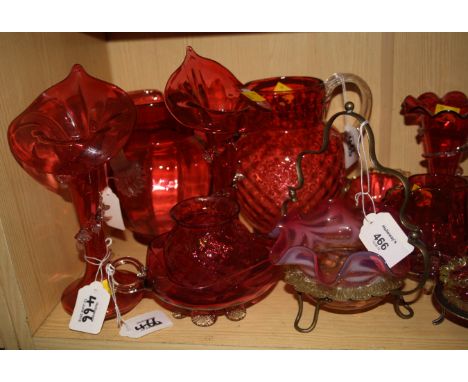 A pair of Victorian cranberry 'Jack in the pulpit' vases, with applied clear trailing decoration, together with a large cranb