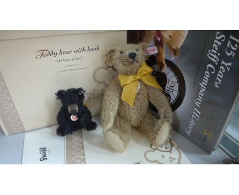 A Steiff Bear with 125 years of Steiff book, 25cm high, mohair, limited edition number 395 of 1880 together with A Steiff Win