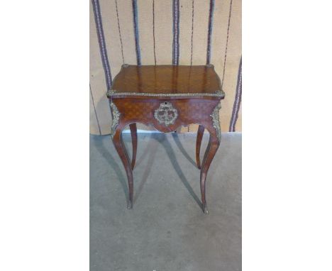 A 19th century rosewood ladies side table with tumbling block design rising mirrored top having ormulu mounts on shaped legs,