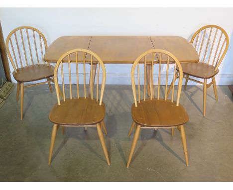 An Ercol drop leaf table with four Ercol chairs, table approx 136cm W x 74cm D, all structurally sound 