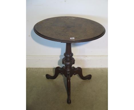 A 19th century walnut top tripod side table 