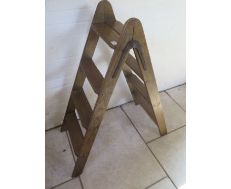 A 4-step double sided ladder, waxed for decorative use - 102cm long, in good condition 
