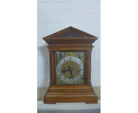 A good quality mahogany 3 train bracket/mantle clock with a W &amp; H sch movement chiming on three gongs - 41cm tall, in run