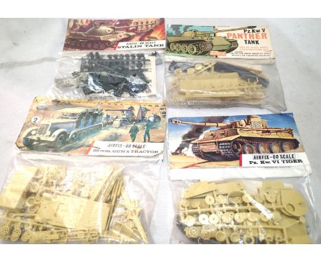 Four vintage Airfix bagged military kits, Panther tank, Stalin tank, Tiger tank, 88 gun and tractor, appear complete/unchecke