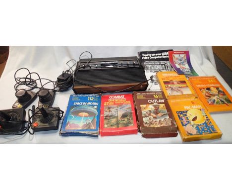 Atari console with power pack, two joysticks, two paddles plus six games with booklet, boxes are poor, also instruction book 