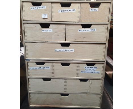 Two wooden chests of drawers containing a selection of modelling items, including air brush, files, brushes, paints, wire, sw