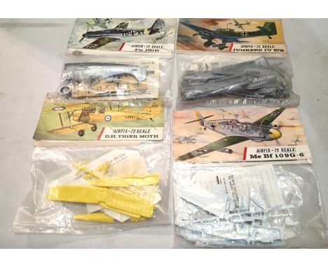 Four early Airfix bagged aircraft kits, Junkers JU87, MEBF109G, FW190D, Tiger Moth, all appear complete/unchecked. UK P&amp;P