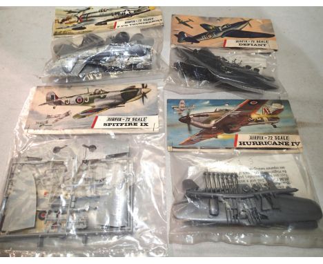 Four early Airfix bagged aircraft kits, Spitfire, Hurricane, Defiant, Thunderbolt, appear complete/unchecked. UK P&amp;P Grou