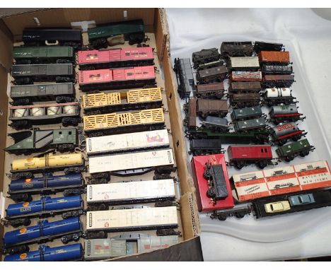 Fifty assorted OO scale wagons, various makes and types including Triang transcontinental series, mostly fair to good conditi