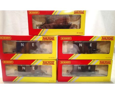 Four OO scale Hornby R6422 vans and R6368 twenty ton brake van, all in excellent to near mint condition. UK P&amp;P Group 1 (