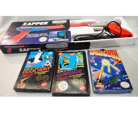 Nintendo Zapper video gun, plus three related games. UK P&amp;P Group 1 (£16+VAT for the first lot and £2+VAT for subsequent 