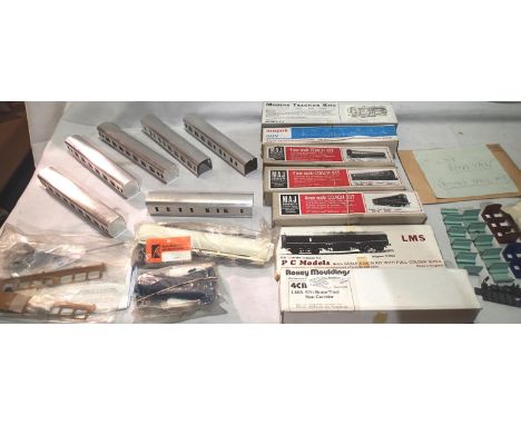 Seven OO scale coach kits, appear as new, complete but unchecked plus six aluminium coach bodies, plus interior parts, Bogie 