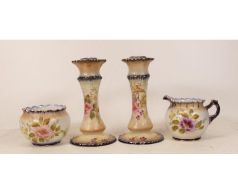 Carltonware Wiltshaw &amp; Robinson Ivory Blushware Hibiscus patterned milk jug together with sugar dish and a pair of candle