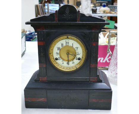 A Victorian Slate Mantle Clock with Enamel Arabic Numeral Dial. Some small nibbles and chips. Height: 33.6cm 