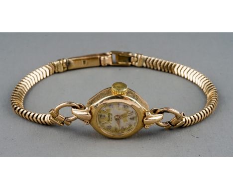 A 9ct yellow gold ladies Rotary wristwatch, circular dial, on a 9ct gold snake-link bracelet strap, total gross weight approx