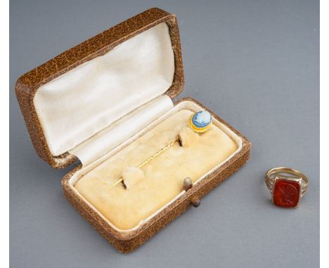 A late 19th/early 20th century yellow gold cameo stick pin, set with an oval blue and white glass cameo portrait, stamped '18