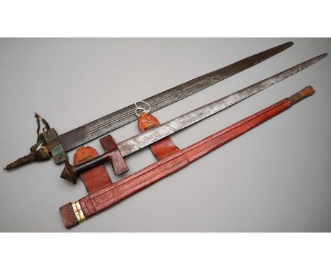 The first in red leather which matches the cross guard, the handle being darker leather, blade in good condition; the other m