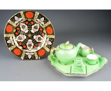 A Royal Winton apple green breakfast set comprising teapot, milk jug, sugar bowl and toast rack on stand, the teapot with ros