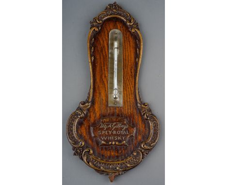 A 20th Century Gilbey's Spey-Royal Whiskey wall thermometer, with carved borders, approx 34cm longThe mounted thermometer is 