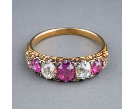 A yellow gold ruby and diamond five-stone ring, set with three graduated rubies and two old-cut diamonds, diamond chip highli