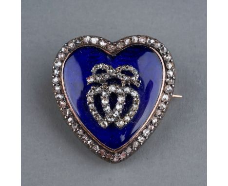 A late 19th century diamond and enamel heart shaped brooch/pendant, the blue enamel heart set with two rose cut diamond entwi