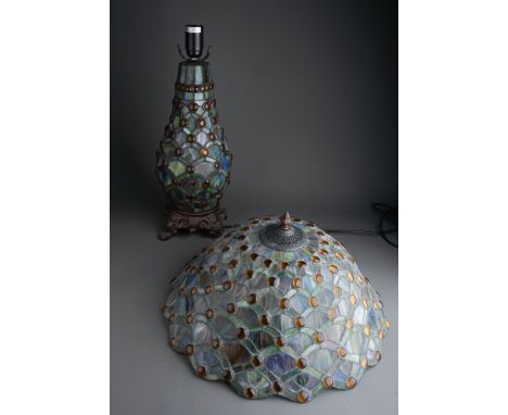 A Continental Tiffany style stained glass lamp stylised fan decoration to shade and stand with amber glass roundels, on gilt 