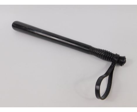A Victorian ebony truncheon with a turned handle, later leather strap, 45cm long.
