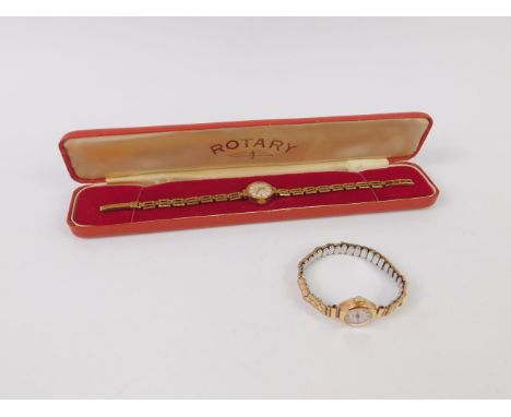 A Rotary lady's 9ct gold circular cased wristwatch, silvered dial, on a three bar gate bracelet strap, boxed with certificate