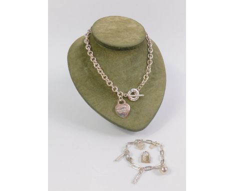 A belcher link Albert chain with pendant engraved 'Please return to Tiffany & Co New York', stamped 925, charm bracelet, stam