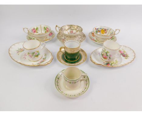 A pair of Copeland late 19thC porcelain coffee cups and saucers, painted with flowers, Wedgwood and Spode coffee cans and sau