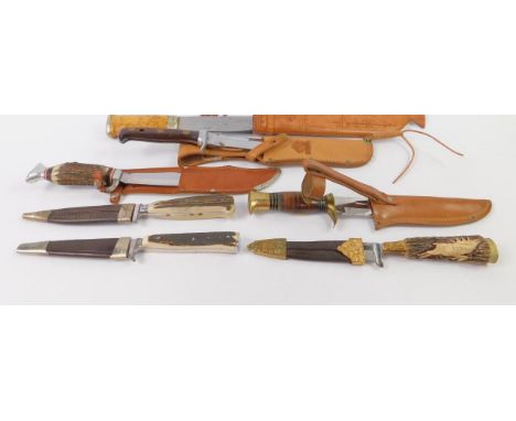 A Puma White Hunter knife, with Solingen blade, and six further German or Finish hunting knives, with sheaths, (7).