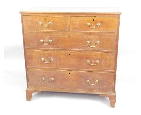 An early 19thC oak chest of drawers, the rectangular top with a moulded edge above two short and three long drawers, on brack