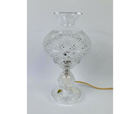 A Waterford cut glass table lamp, of baluster form, with a cut glass shade, 35cm high. 