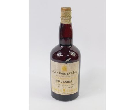 A bottle of John Haig & Co Ltd Gold Label blended Scotch Whisky, lower neck. 