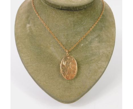 A 9ct gold oval double photo locket, foliate engraved, on a belcher link neck chain, 17.9g. 