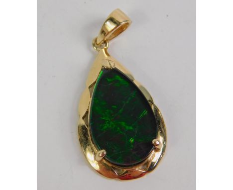 A 9ct gold and opal doublet pendant, of tear drop form, 2.9g.