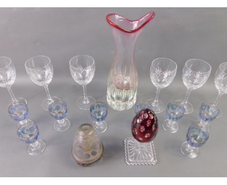 A set of six Edinburgh crystal wine glasses, frosted ruby glass egg on pedestal paperweight, eight Continental etched blue li