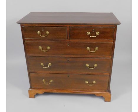 A George III mahogany chest of drawers, two short and three long drawers, raised on bracket feet, 95cm x 48cm x 91cm.