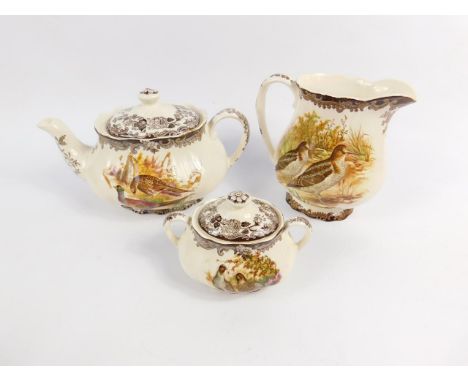 A Royal Worcester Palissy part dinner and tea service, decorated in the Game Series pattern, comprising sauce boat on stand, 