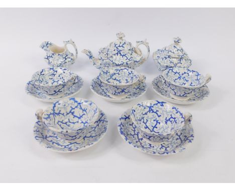 An early 19thC Staffordshire blue and white pottery part child's tea service decorated in a seaweed pattern, comprising teapo