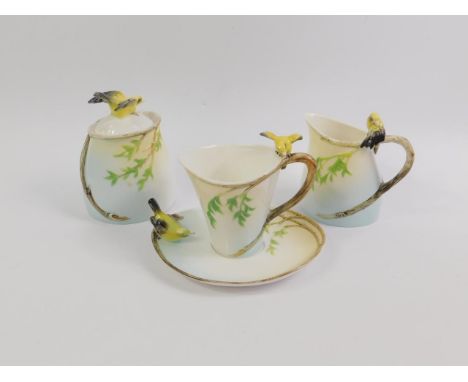 A Graff porcelain coffee cup and saucer decorated in the Canary pattern, together with a cream jug and sucrier, (4).