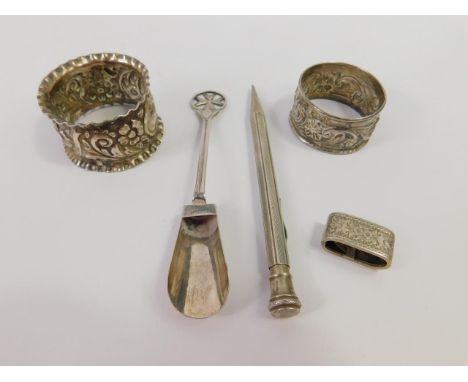 A silver propelling pencil, with engine turned decoration, two silver napkin rings, oval buckle and a Maltese sugar shovel, s