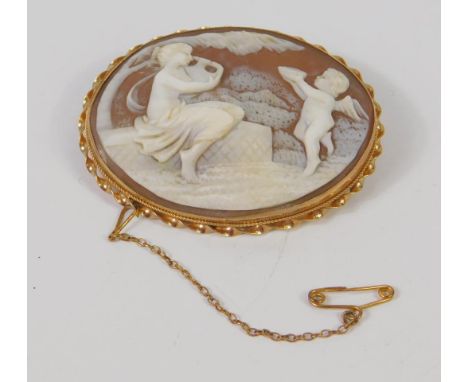 A 9ct gold and shell cameo brooch, carved with a classical woman with an amphora and a cherub with a bowl, with safety chain 