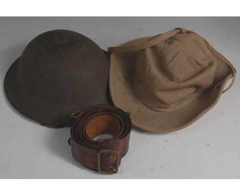 A WWII Brodie pattern steel helmet, having a black leather liner and canvas chin strap, together with a canvas slouch hat and