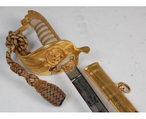 An Elizabeth II Royal Naval dress sword, the 79cm single edged fullered bade etched with a crowned cypher and fouled anchor, 