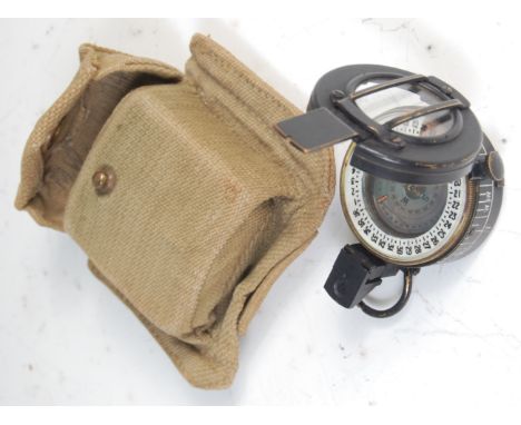 A WW II brass cased prismatic compass, stamped verso T.G.Co. Ltd London No. B 312343 1945 MK III, with canvas belt case.