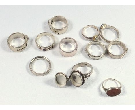 WHITE METAL 'POISON RING' AND TEN OTHER WHITE METAL RINGS, GROSS 71.7 GRAMS (11) 