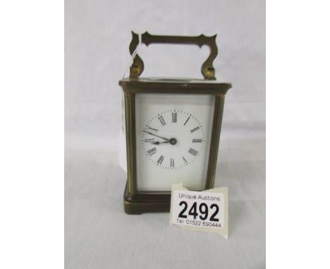 A brass carriage clock.